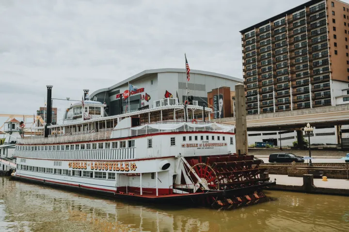 a boat is docked next to a large body of water