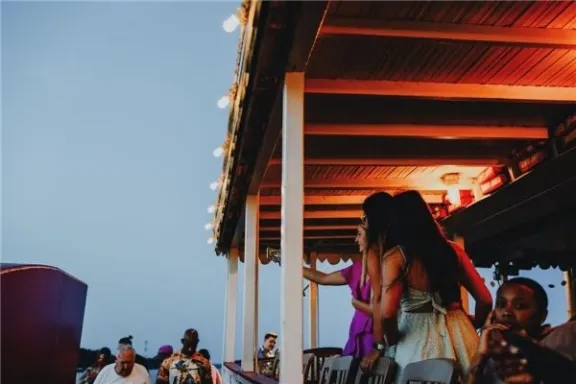 a group of people standing in front of a building