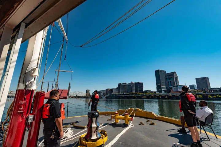 a group of people standing on a bridge