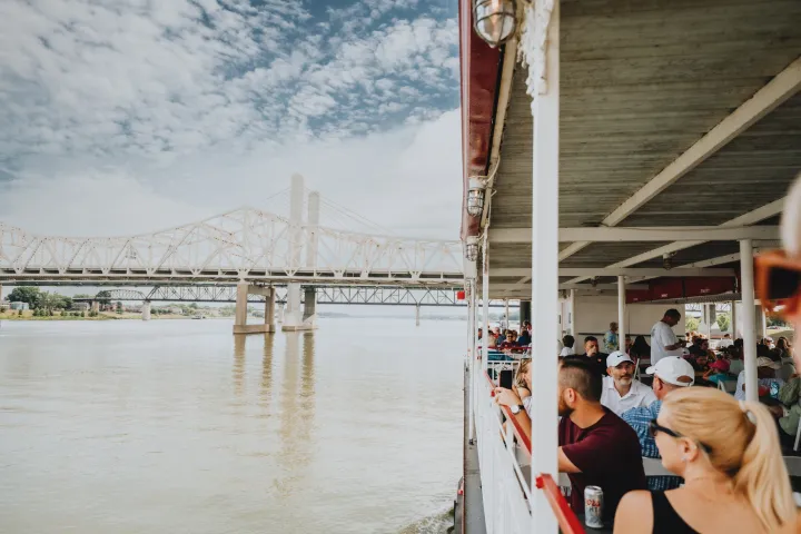 a person standing next to a body of water