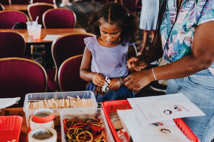 a small child sitting on a table
