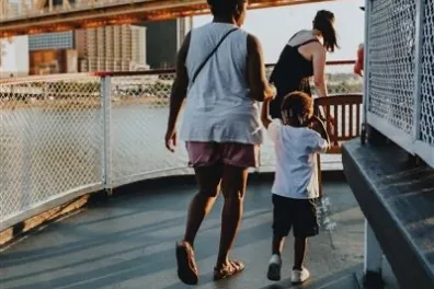 a person walking across a bridge