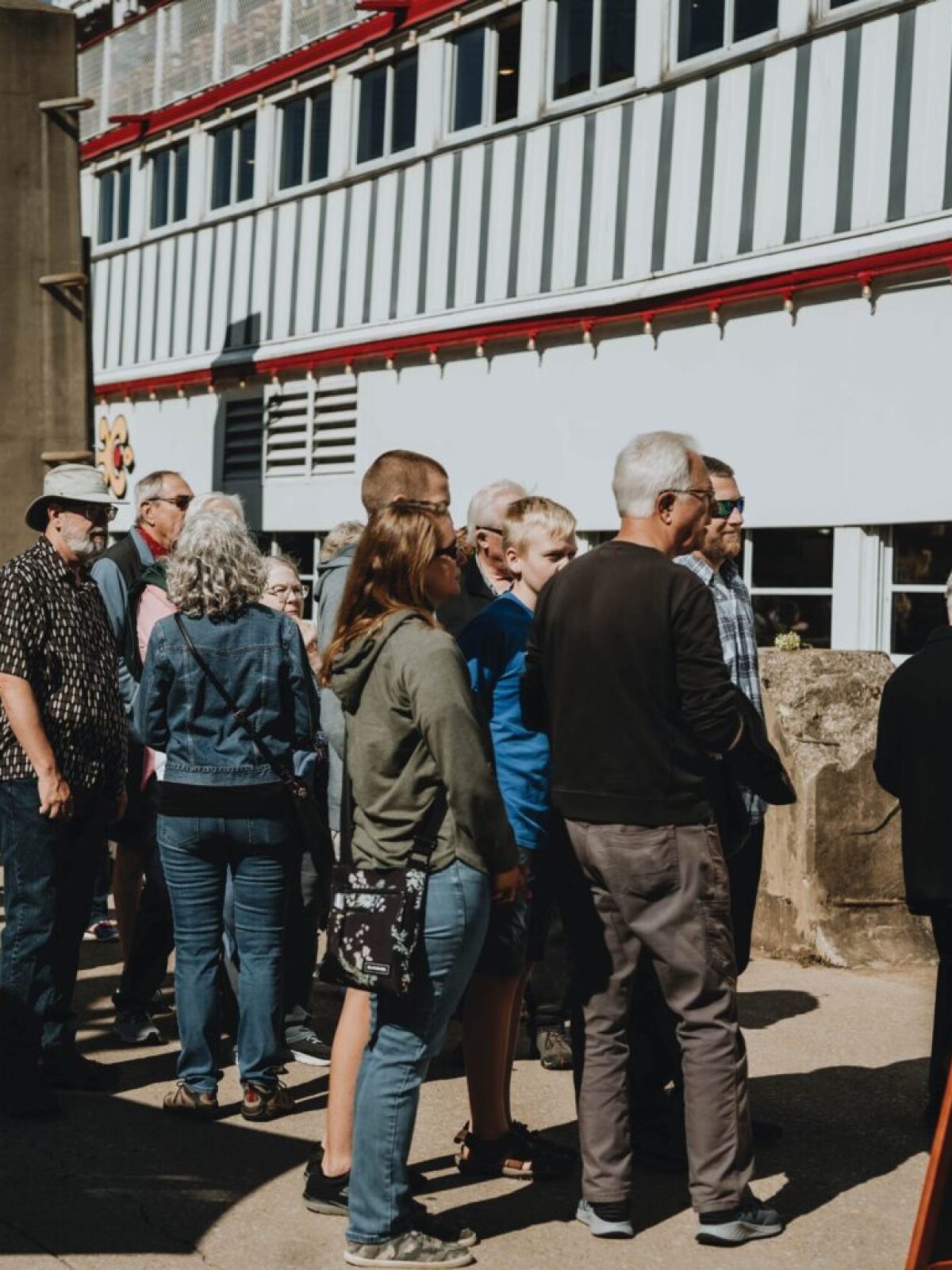 a group of people standing in front of a crowd