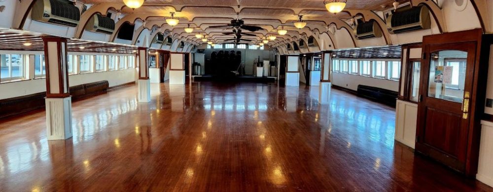 a room filled with furniture on top of a hard wood floor