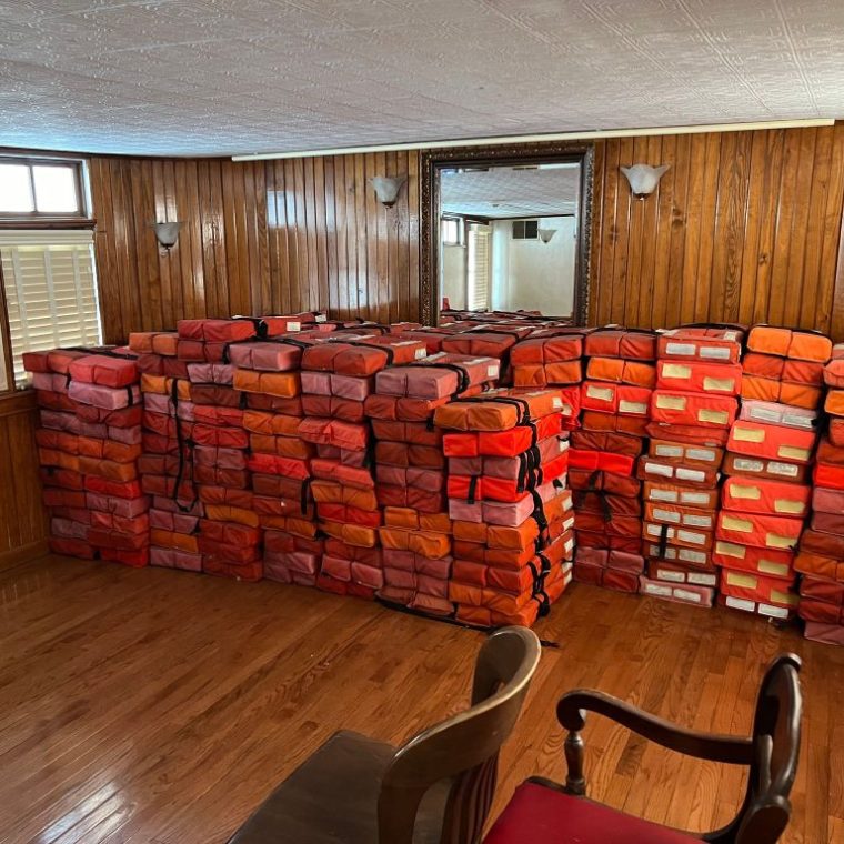 a room filled with furniture and a large window