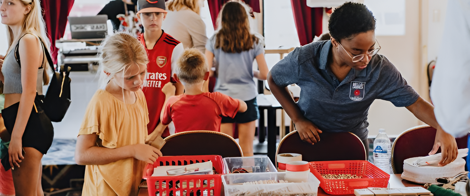 a group of people standing around a table