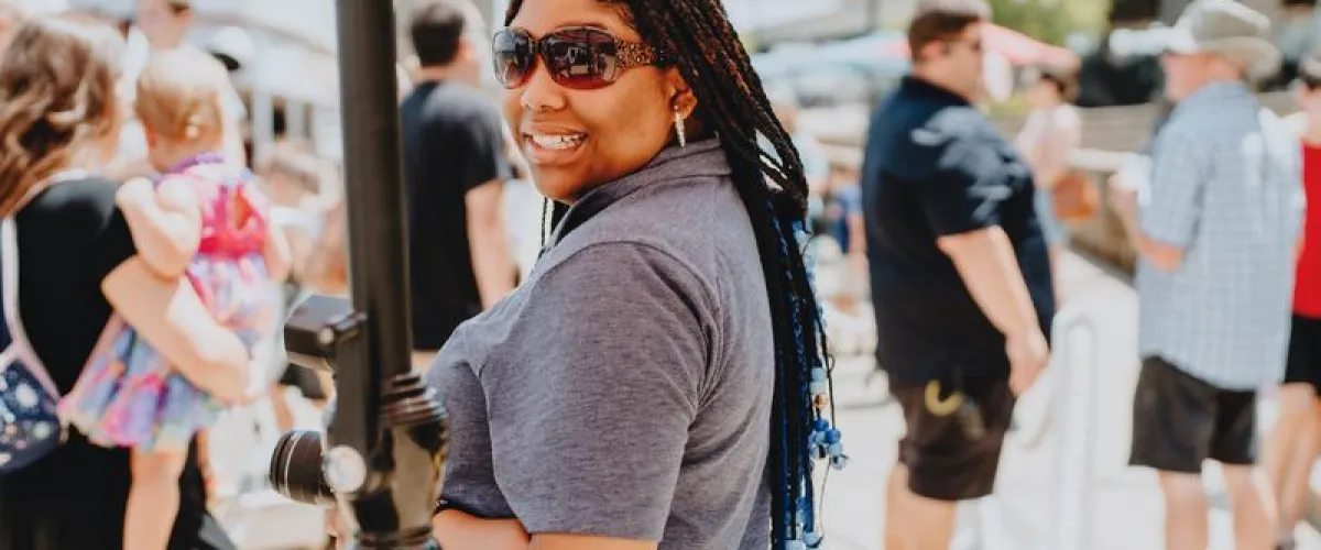 a woman standing in front of a crowd
