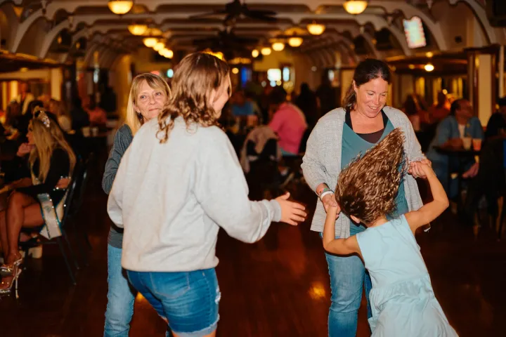 a group of people standing in a room
