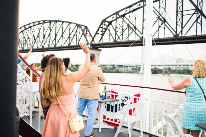 a group of people standing on a bridge