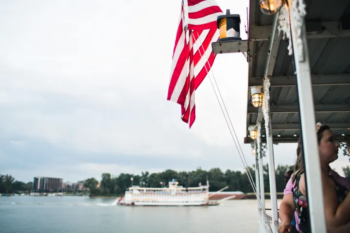 a person standing next to a body of water