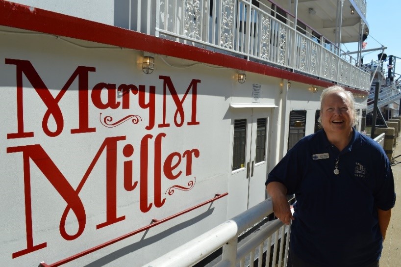 a man standing in front of a sign