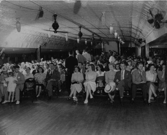 a group of people standing in front of a crowd